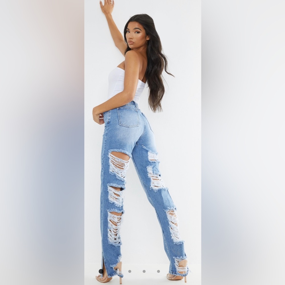 Never worn Light Blue Wash Ripped Back Split Hem Jeans